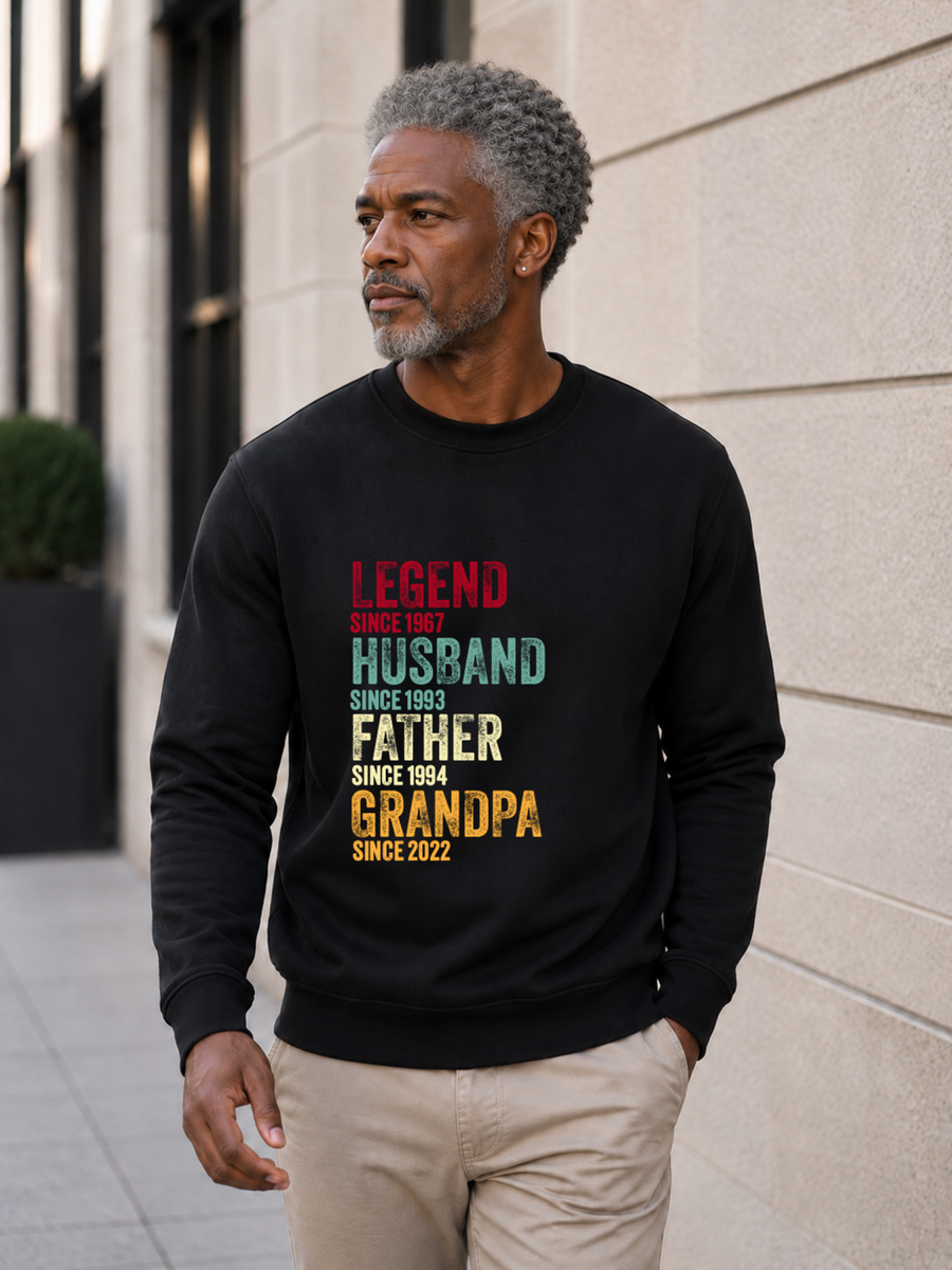 personalized Legend Husband Father Grandpa sweatshirt with vintage distressed typography and custom years worn by mature male model outdoors.