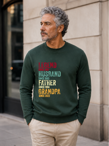 personalized Legend Husband Father Grandpa sweatshirt with vintage distressed typography and custom years worn by mature male model outdoors.