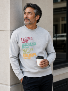 personalized Legend Husband Father Grandpa sweatshirt with vintage distressed typography and custom years worn by mature male model outdoors.
