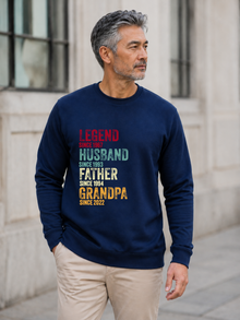 personalized Legend Husband Father Grandpa sweatshirt with vintage distressed typography and custom years worn by mature male model outdoors.