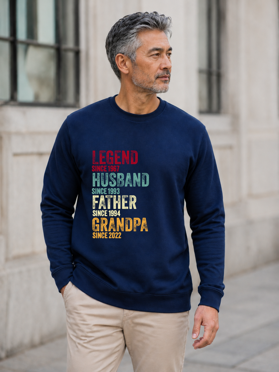personalized Legend Husband Father Grandpa sweatshirt with vintage distressed typography and custom years worn by mature male model outdoors.