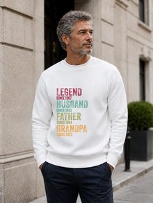 personalized Legend Husband Father Grandpa sweatshirt with vintage distressed typography and custom years worn by mature male model outdoors.