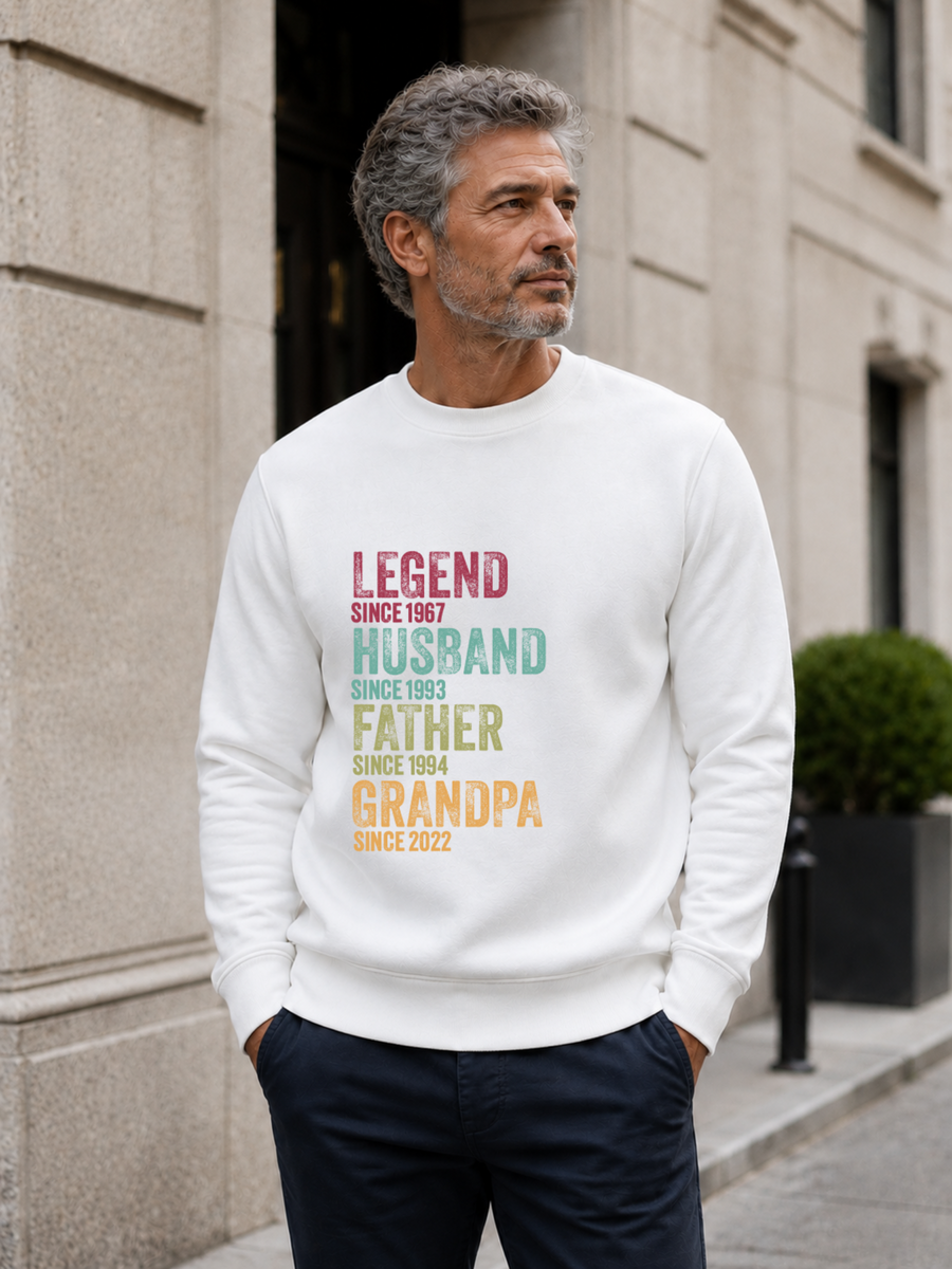 personalized Legend Husband Father Grandpa sweatshirt with vintage distressed typography and custom years worn by mature male model outdoors.