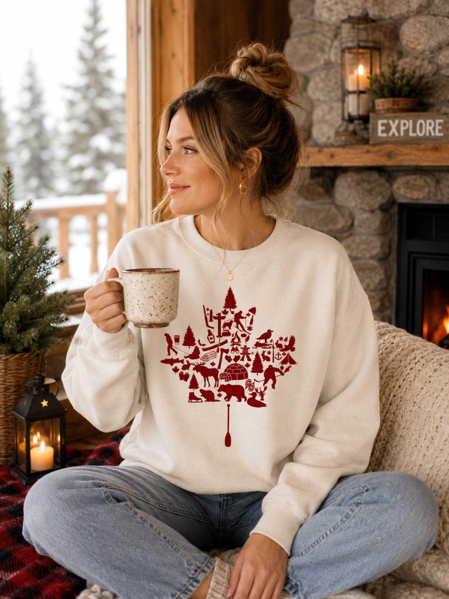 Canadian Wilderness Maple Leaf graphic t-shirt featuring iconic Canadian wildlife, camping, paddling, hockey, and outdoor adventure symbols arranged inside a maple leaf design.