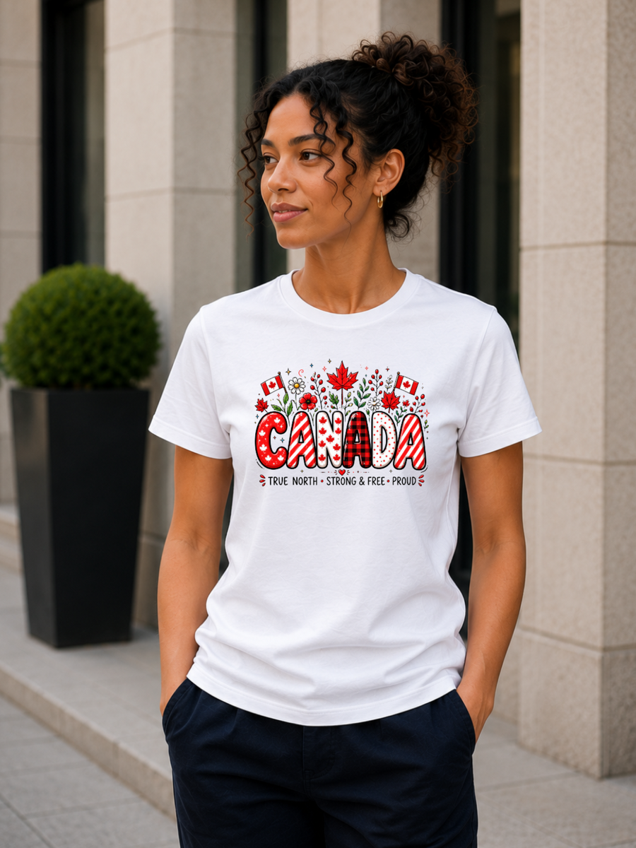 white Canada Proud t-shirt featuring colorful red and white Canadian-themed artwork with maple leaves, Canadian flags, flowers, and patriotic graphics.