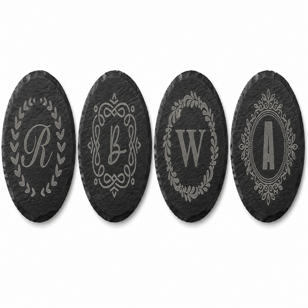 Personalized round black slate coaster engraved with custom monogram initial, elegant decorative border design, custom wedding and housewarming gift.