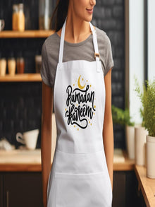 wearing white Ramadan Kareem apron with Islamic calligraphy design in modern kitchen