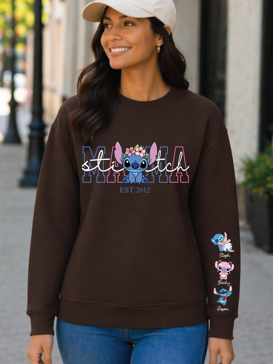 Woman wearing a brown sweatshirt with 'stitch' design on a city street.