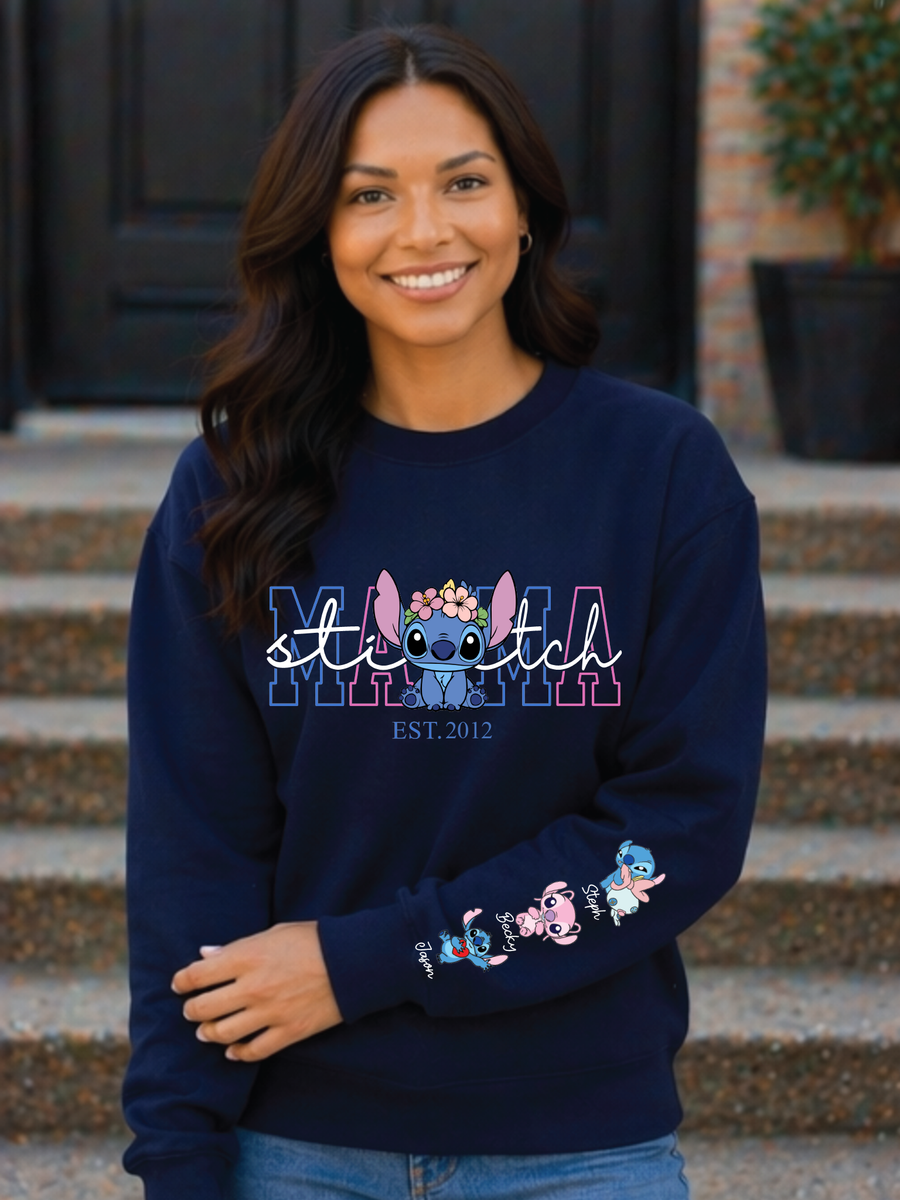 Woman wearing a navy blue sweatshirt with cartoon character design and text.