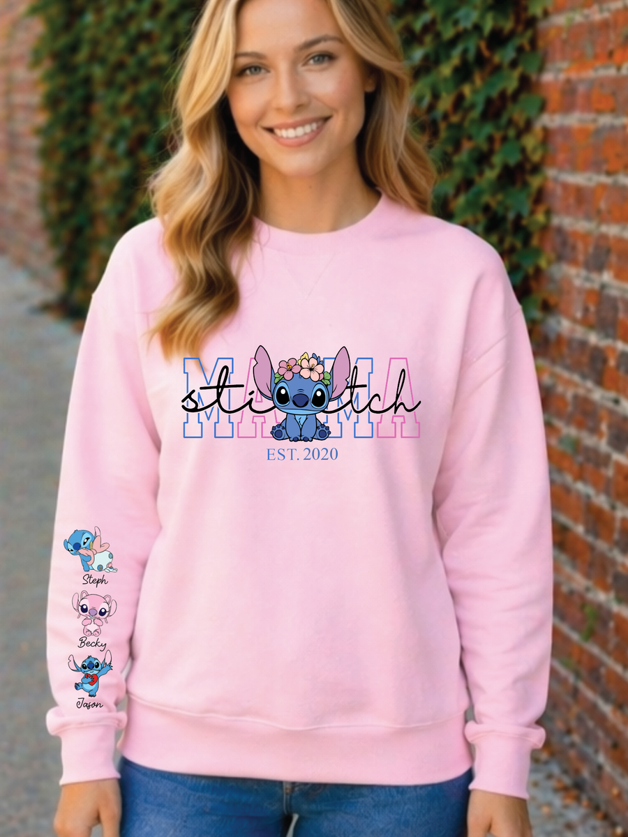 Person wearing a pink sweatshirt with 'Stitch' design and text, standing against a brick wall.