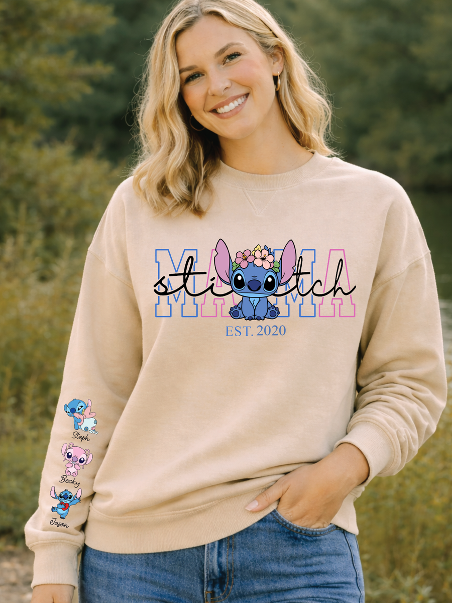 Woman wearing a beige sweatshirt with 'Stitch' design and text, standing outdoors.