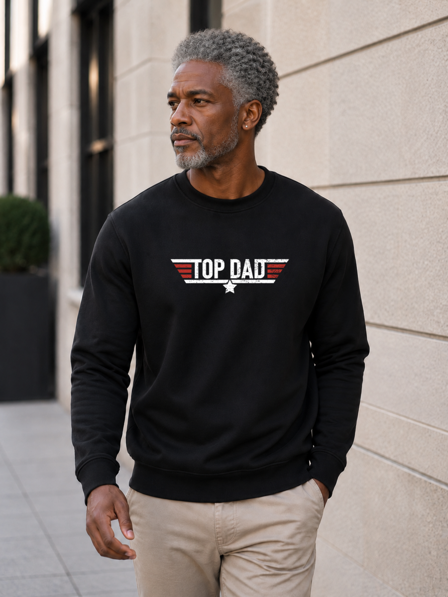 Top Dad sweatshirt featuring vintage distressed Father's Day graphic with patriotic stripes and star design worn by male model outdoors.