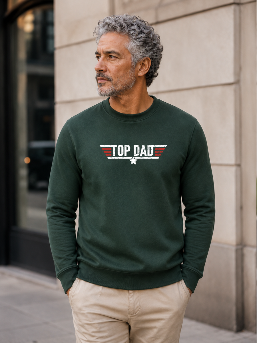 Top Dad sweatshirt featuring vintage distressed Father's Day graphic with patriotic stripes and star design worn by male model outdoors.