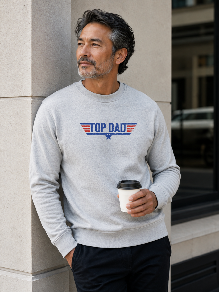 Top Dad sweatshirt featuring vintage distressed Father's Day graphic with patriotic stripes and star design worn by male model outdoors.