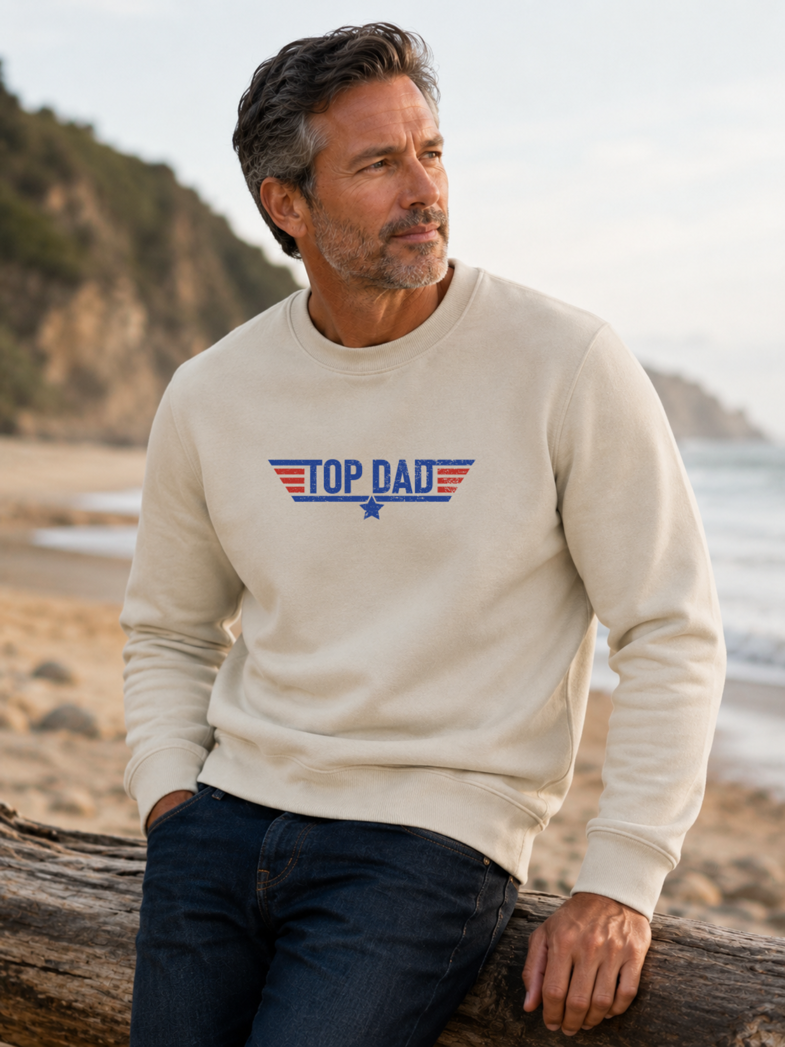 Top Dad sweatshirt featuring vintage distressed Father's Day graphic with patriotic stripes and star design worn by male model outdoors.