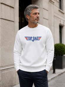 Top Dad sweatshirt featuring vintage distressed Father's Day graphic with patriotic stripes and star design worn by male model outdoors.